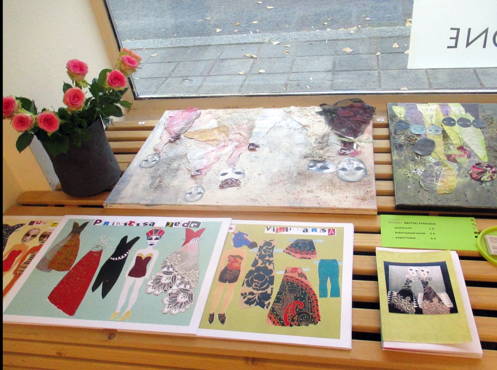 PAPERINUKKEJA IKKUNALAUDALLA